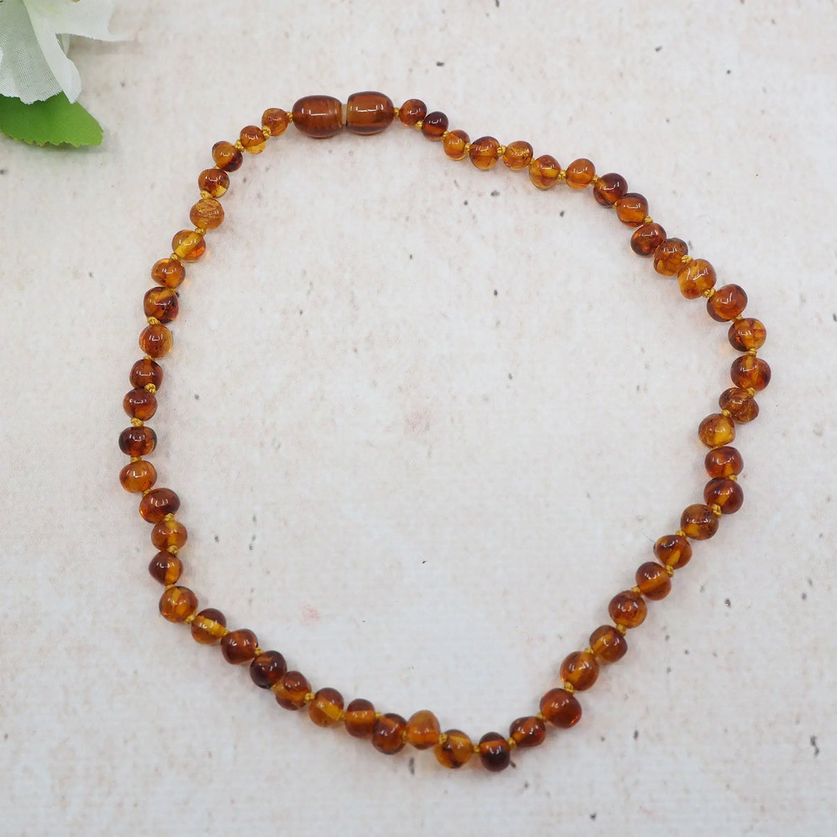Collier d'ambre pour bébé - Baroque Cognac